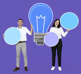 Creative people with a blue light bulb symbol