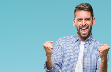 Young handsome man wearing white t-shirt over isolated background very happy and excited doing...