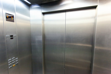 interior of a modern silvery elevator - obrazy, fototapety, plakaty