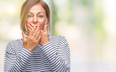 Middle age senior hispanic woman over isolated background shocked covering mouth with hands for mistake. Secret concept.