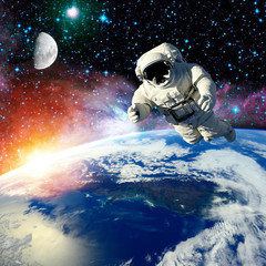 Fototapeta premium the astronaut fliing outer space.elements of this image furnished by NASA