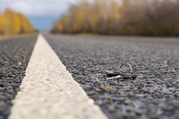 Lost a bunch of keys lying on the asphalt surface of the roadway