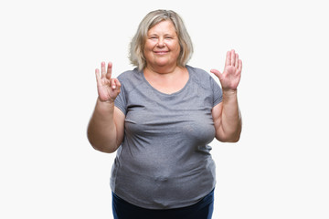 Senior plus size caucasian woman over isolated background showing and pointing up with fingers number eight while smiling confident and happy.