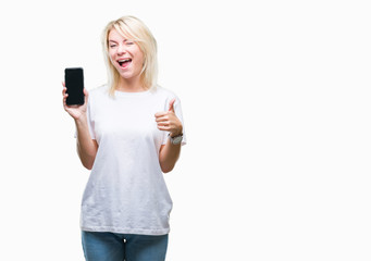 Young beautiful blonde woman showing screen of smartphone over isolated background happy with big smile doing ok sign, thumb up with fingers, excellent sign