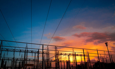 Electricity power station,Power distribution system to sunset sky background.