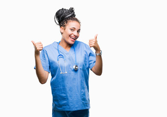 Young braided hair african american girl professional surgeon over isolated background success sign...