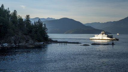 Ferryboat carrying cars and passangers approaching the terminal. Beautiful British Columbia, Canada.