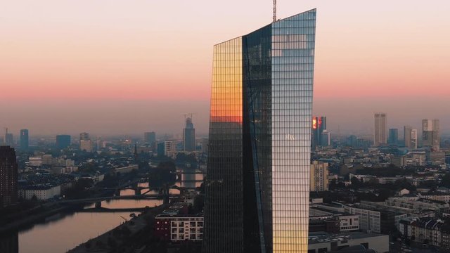 Frankfurt ECB Skyline Aerial Shot at early sunrise reflecting sun