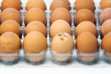 Egg container with one of eggs broken
