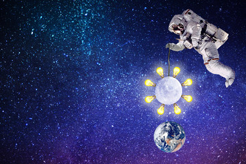 Naklejka premium astronaut lighting moon planet Earth.elements of this image furnished by NASA