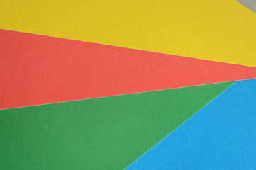 Background and texture of multicolored sheets of cardboard close up