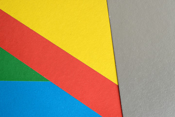 Background and texture of multicolored sheets of cardboard close up