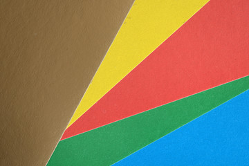 Background and texture of multicolored sheets of cardboard close up