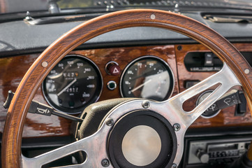 Steering wheel inside old car interior