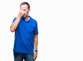 Middle age hoary senior man over isolated background tired rubbing nose and eyes feeling fatigue...