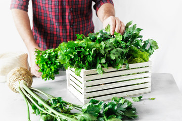 Farmer freshly herbs wooden box white table Harvesting