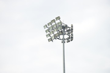 Stadium lights inside a stadium on a overcast day background