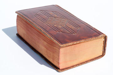 Old book in a shiny embossed brown leather cover with all gilt edges