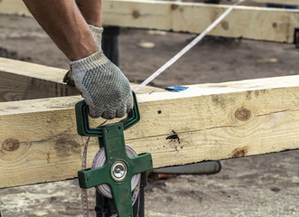 Measurements of building construction with a tape measure.