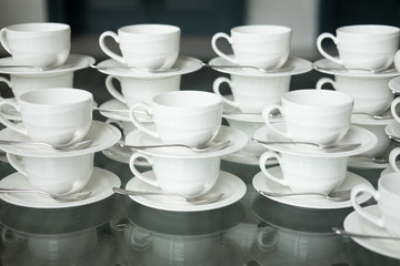 Cups for coffee or tea with spoons