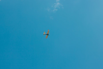 sun and cumulus white clouds against a beautiful blue sky, fly plane