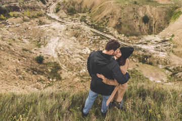 couple standing at the edge of the cliff