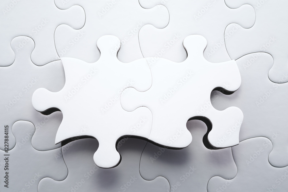 Leinwandbilder The correct solution. Solving and completing the task.Last tow pieces of jigsaw puzzle. Assembling white jigsaw puzzle pieces.