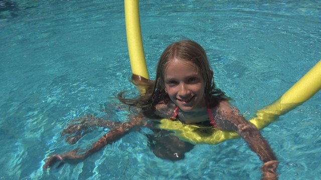 Child Swimming in Pool, Smiling Kid, Girl Portrait Enjoying Summer Vacation
