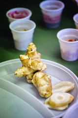 Jerusalem artichoke on a white plastic plate