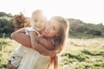 Fototapeta premium Happy Mother and Son Having Fun, Enjoying Sunny Summer Day