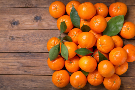 Fresh mandarin oranges fruit or tangerines with leaves, top view