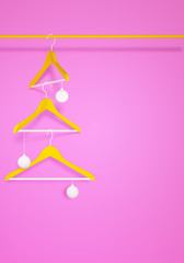 Christmas fashion concept, yellow hangers and christmas balls on pink background, 3d render