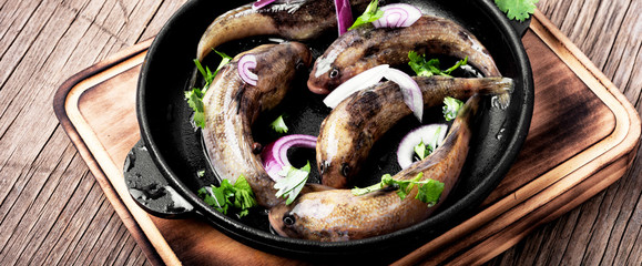 Frying pan with tasty fish