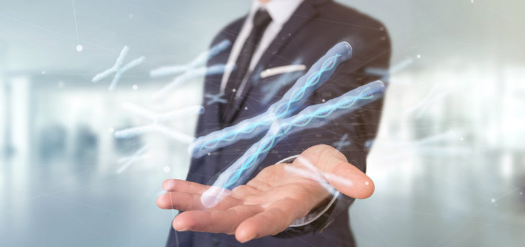 Businessman holding a Group of chromosome with DNA inside isolated on a background 3d rendering