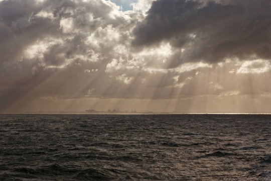Incoming storm over Ijmuiden dock seen from sea, North Sea, Netherlands