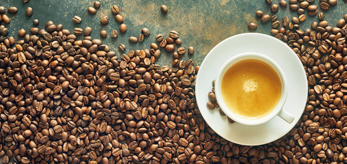 Panorama banner with cup of coffee and beans