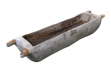 An old vintage drinking bowl for cows or a pig feeder hollowed out of a solid oak trunk