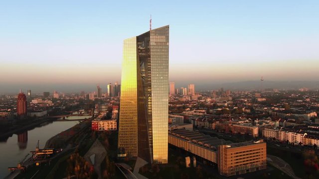 Frankfurt ECB Skyline Aerial Shot at early sunrise reflecting sun