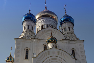 Russian orthodox temple with golden domes. Russian religious architecture.