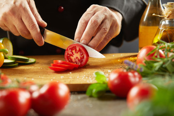 Chef preparing a healthy salad with fresh food