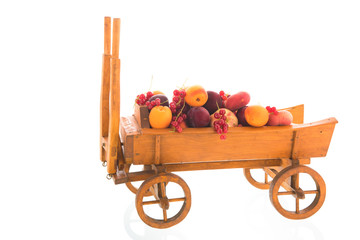 Antique wooden farmers cart with fresh fruit