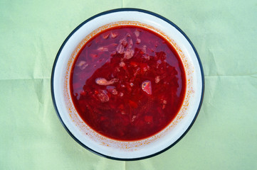 Hot red rustic soup in meat broth from vegetables and beetroot- borsch