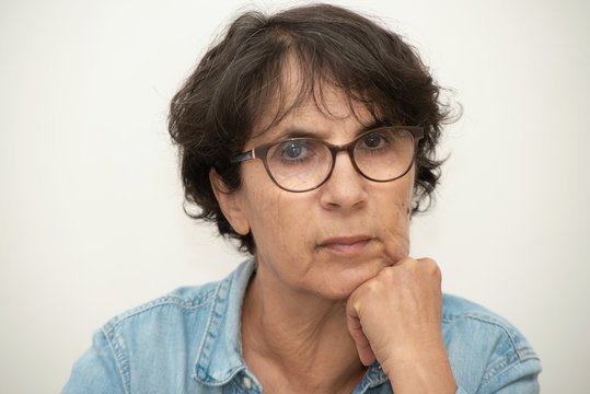 portrait of a beautiful mature woman with eyeglasses