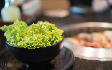 Bowl of green oak Located on a barbecue table.