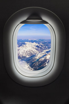 Fototapeta Mountains Alps at Austria in airplane window