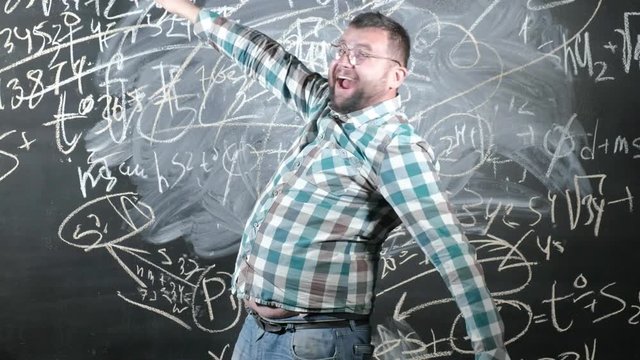 A brilliant mature mathematician brings a big board and completes an essay Complicated mathematical formula equation