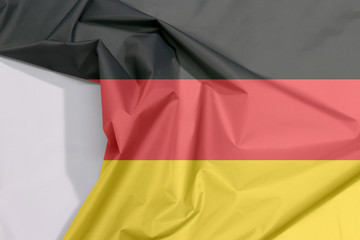 Germany fabric flag crepe and crease with white space, the black red and yellow color.