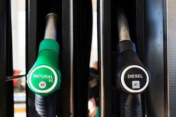 New fuel labeling at petrol station pumps with new EU labels, sunny day