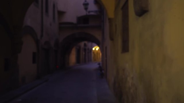 View of narrow European street with archways