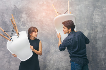 Husband and wife couples, Asians are Brawl. He made two gestures annoy and lift Chair, threatened...